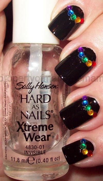 Colored rhinestone half moons nail art