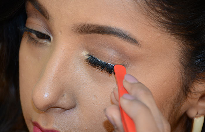 6. Secure The Lashes With Tweezers