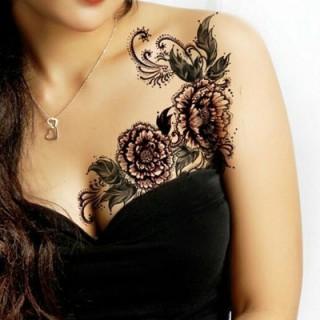 Flowery breast tattoos