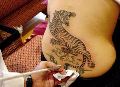 http://cdn2.stylecraze.com/wp-content/uploads/2013/06/bengal-tiger-tattoo.jpg