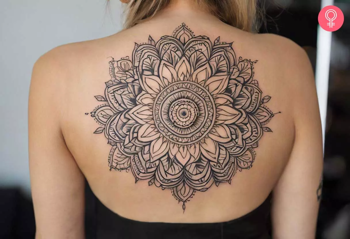 A pattern tattoo for women etched on the upper back