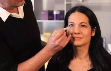 Step 2 of makeup for women over 40 is to apply concealer