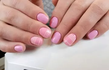 Pink manicure with white stripes