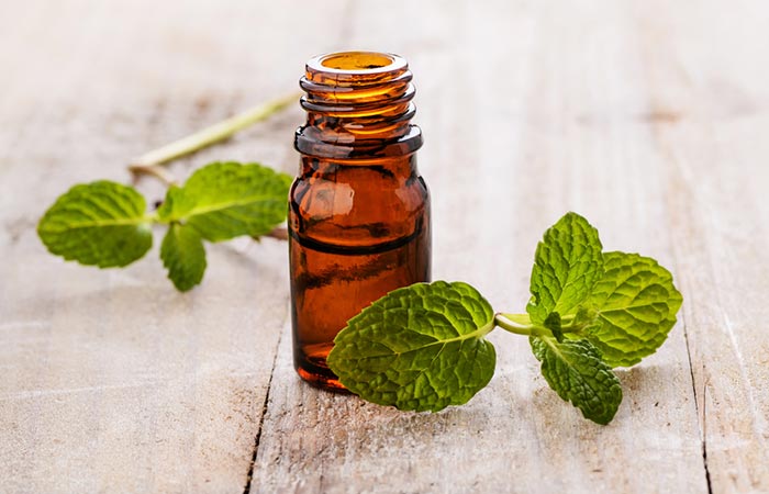 A bottle of peppermint essential oil for hair