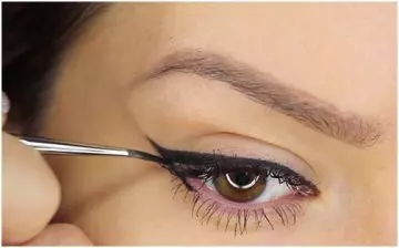 Applying liquid eyeliner to lower lid step 1