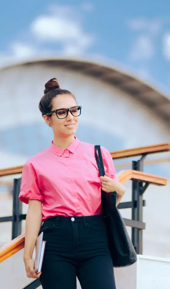 A woman with a top knot hairstyle