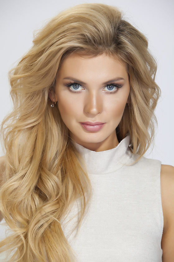 Back brushed blonde cascading wavy hairstyle for a square face