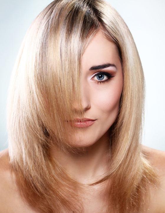 Blonde fine layers with bangs hairstyle for a square face