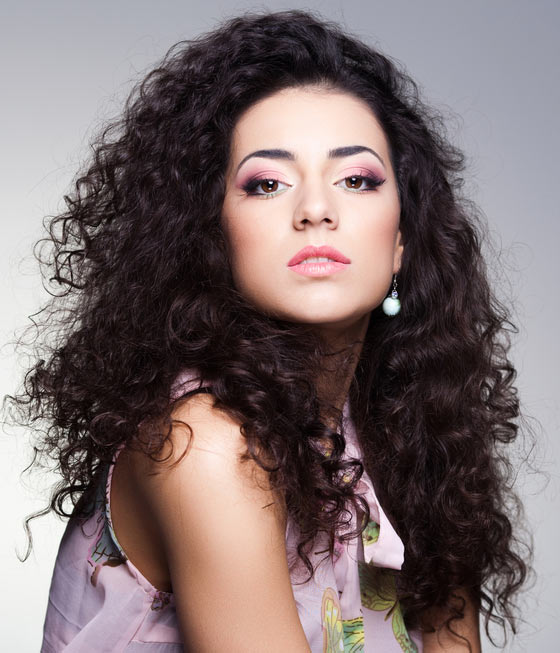 Tight black curls hairstyle for a square face