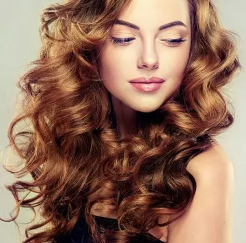 Cascading long waves hairstyle for a square face