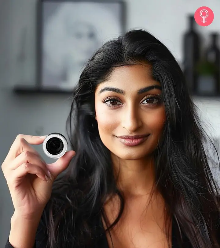 A girl holding a gel eyeliner product box