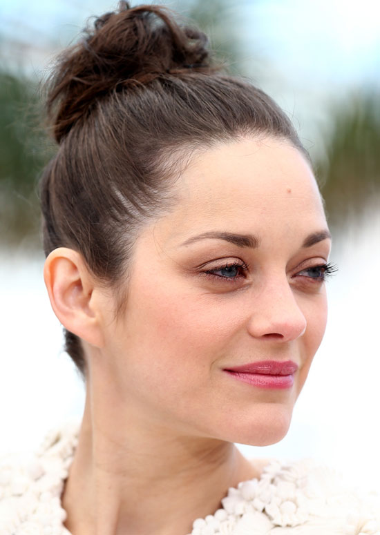 Messy high bun hairstyle for professional women