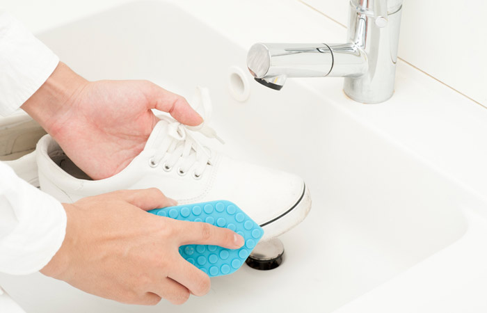Make your feet soft by washing your footwear