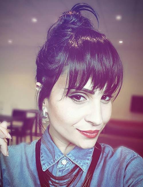Bun with long tapered bangs