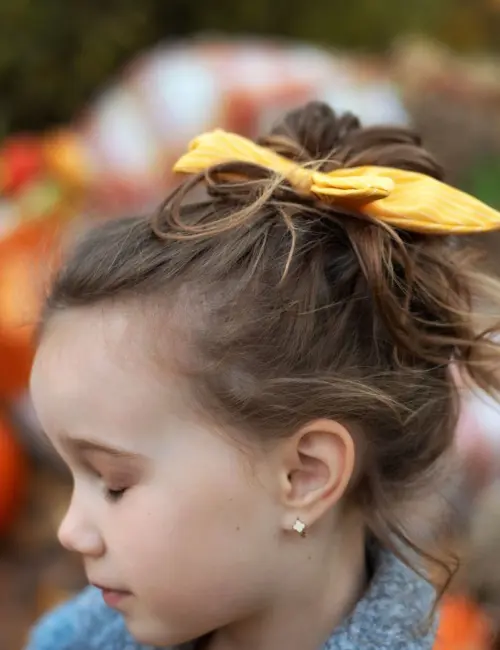 A girl in a messy bun