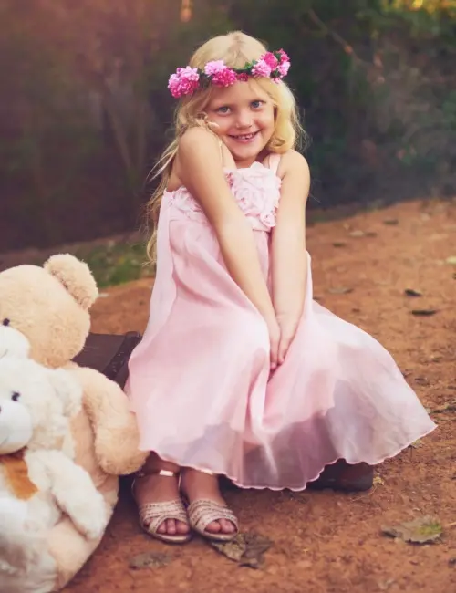 A little girl with floral headband