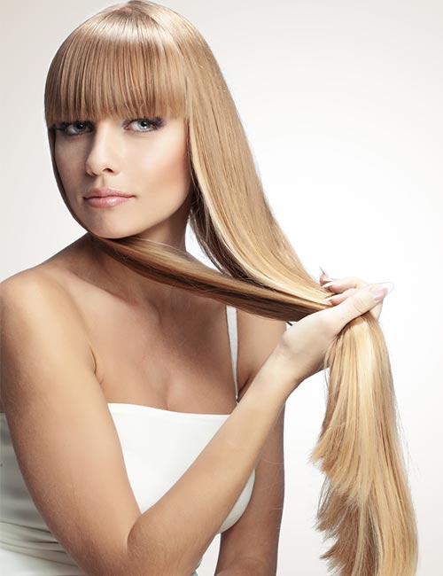 Long blonde hair with traditional bangs