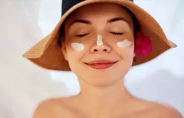 Woman with sunscreen on her face