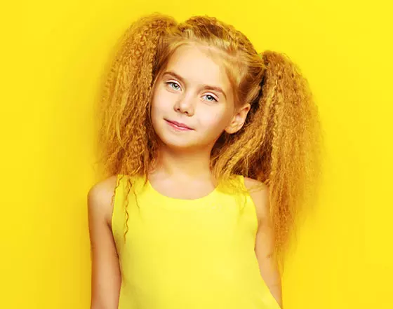 Densely curled high pigtails for little girls