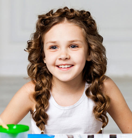 Elegant curly layers hairstyle for little girls
