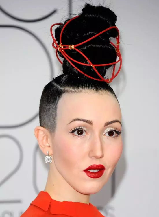 Super high topknot with shaved sides bold bald and beautiful hairstyle