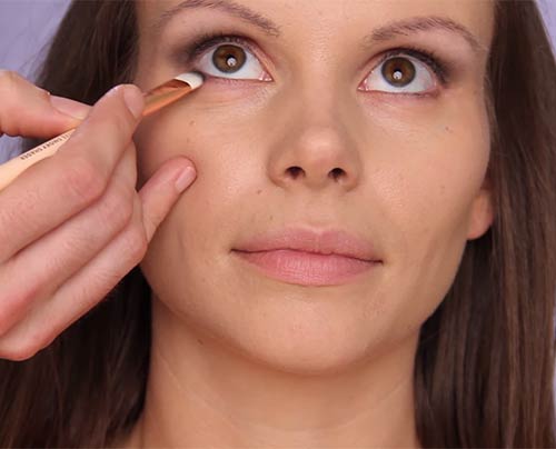 Step 5 of makeup for deep-set eyes is to enhance your lower lash line