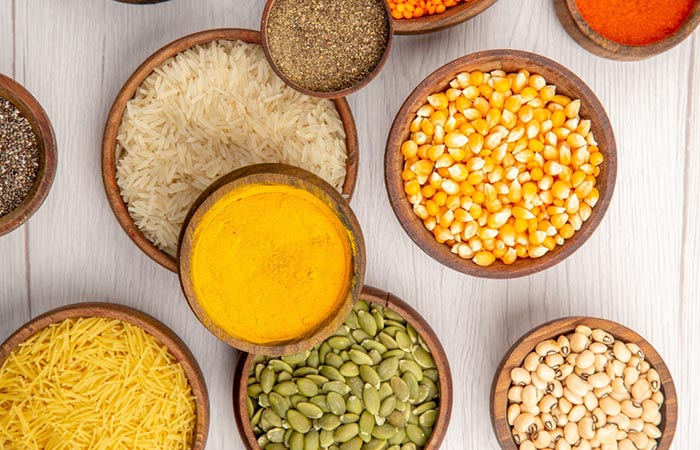 Bowls of raw rice, lentils, turmeric, and more to offer glowing skin