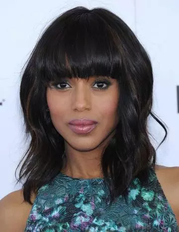 Voluminous bob with blunt bangs hairstyle for round face