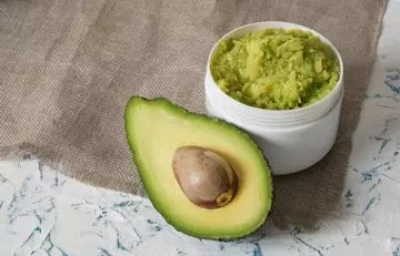 Mashed avocado and half the fruit to prevent dry skin around eyes 