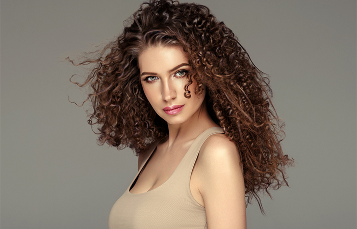 Woman with curly layered hairstyle