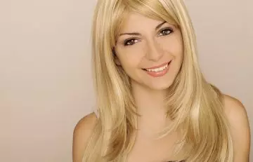 Woman with long blonde V layered hairstyle