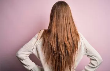 Woman with subtle V long layered hairstyle