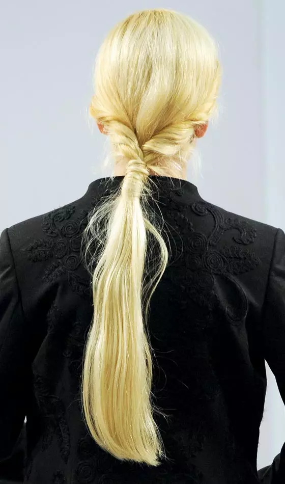 Knotted puffed low pony a puff pony hairstyle
