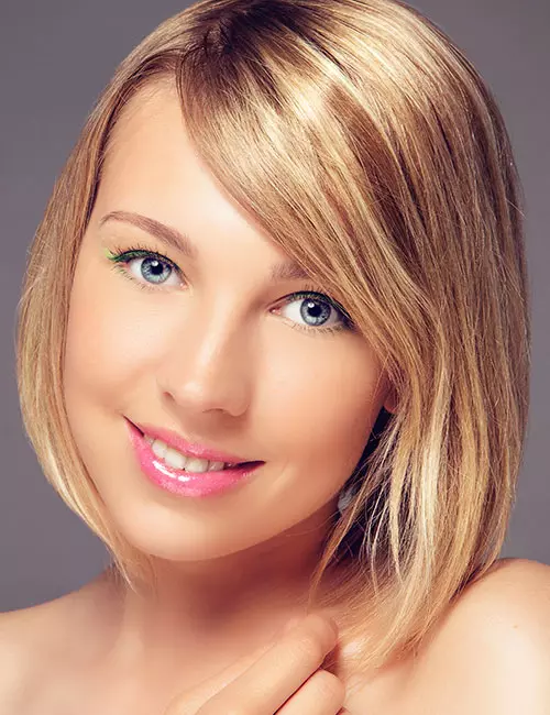 A long bob hairstyle with side-swept bangs