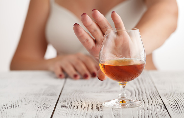 Woman refusing alcohol to stay healthy