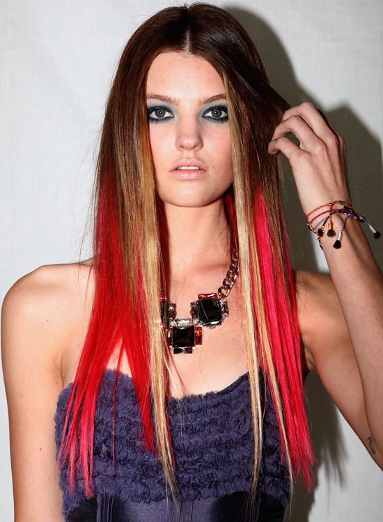 Dark brown hair with golden blonde and red highlights