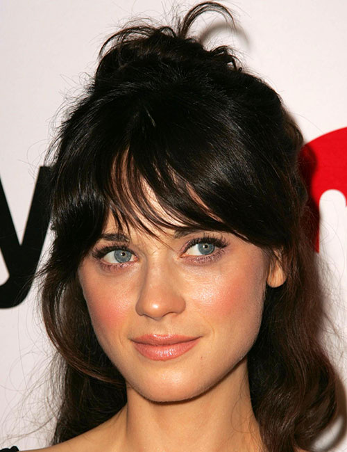 Half top-knot hairstyle with center bangs