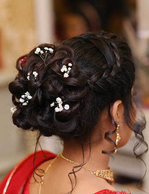 Indian style floral ringlet bun hairstyle