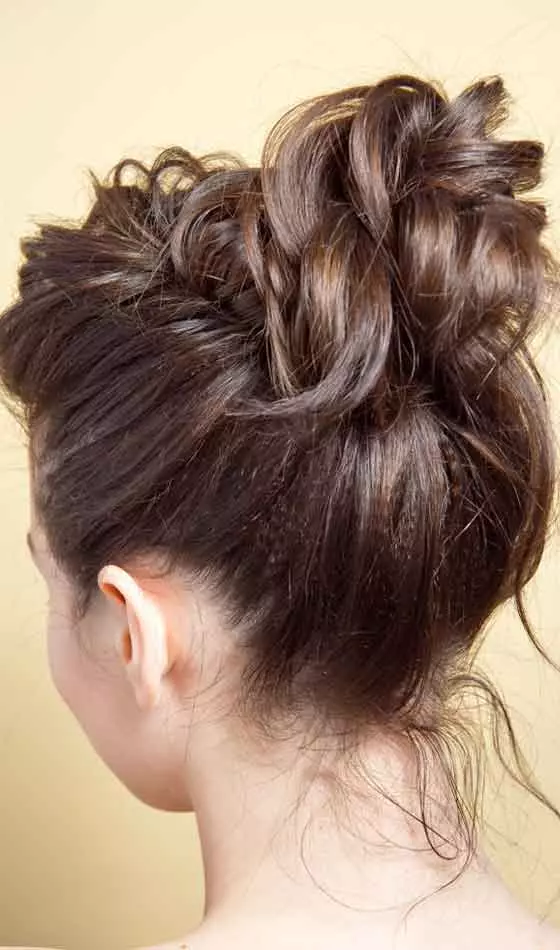 A girl sporting a loose curly updo