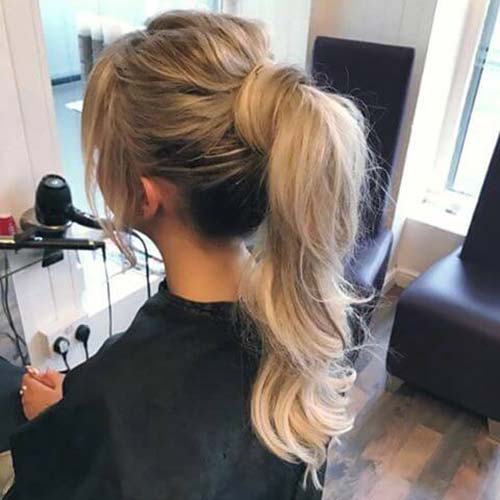 Voluminous ponytail hairstyle for curly hair