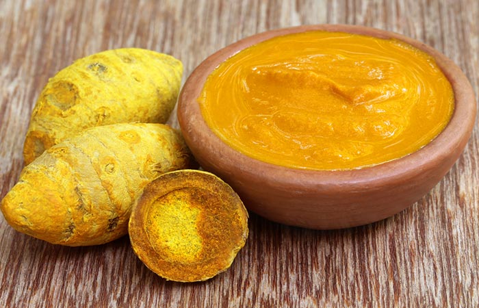 Turmeric paste in wooden bowl