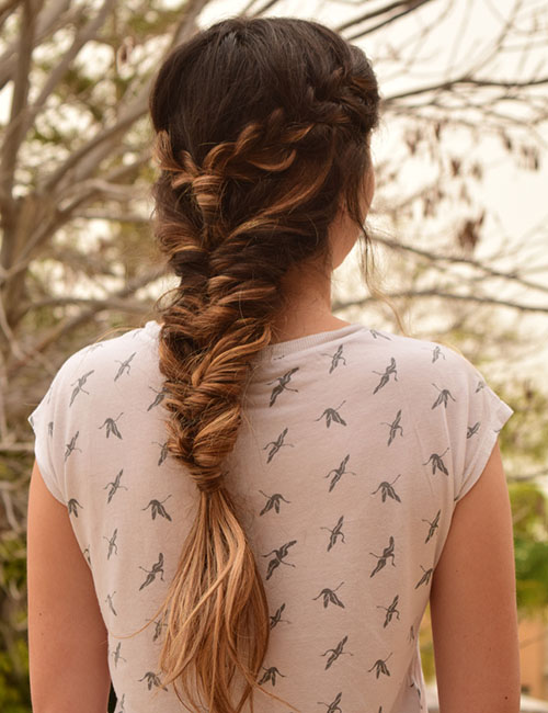 Twisted bangs with fishtail braid for an Indian hairstyle