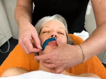 Waxing to remove facial hair