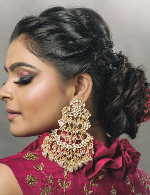 Young Indian female with an elegant twisted bun