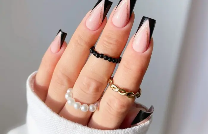 A woman with gorgeous nail extensions