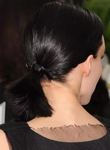 Black low base tied up ponytail edgy hairstyle for medium length hair