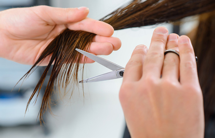 Woman trimming her rebonded hair