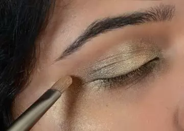 Step 4 of gold eye makeup