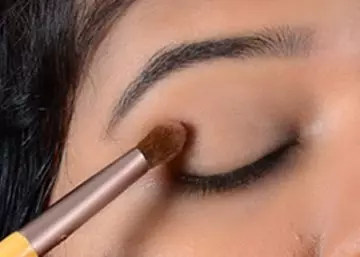 Step 1 of gold eye makeup