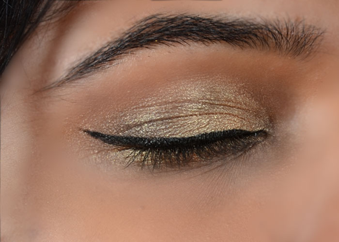Step 6 of gold eye makeup